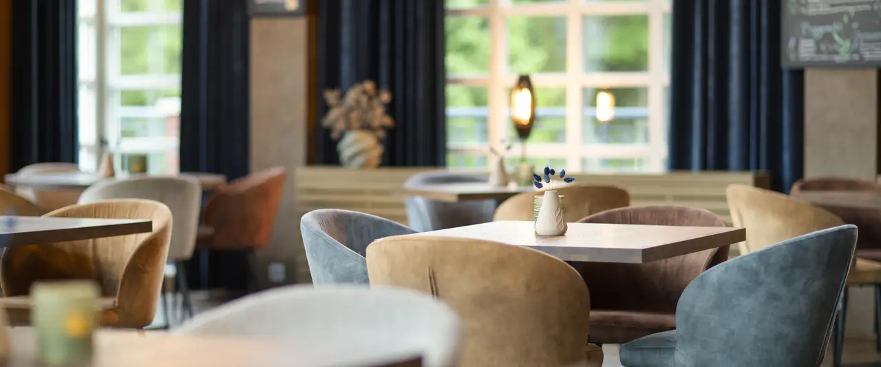 Grand Café of Hotel Residence Groot Heideborgh with modern chairs and tables
